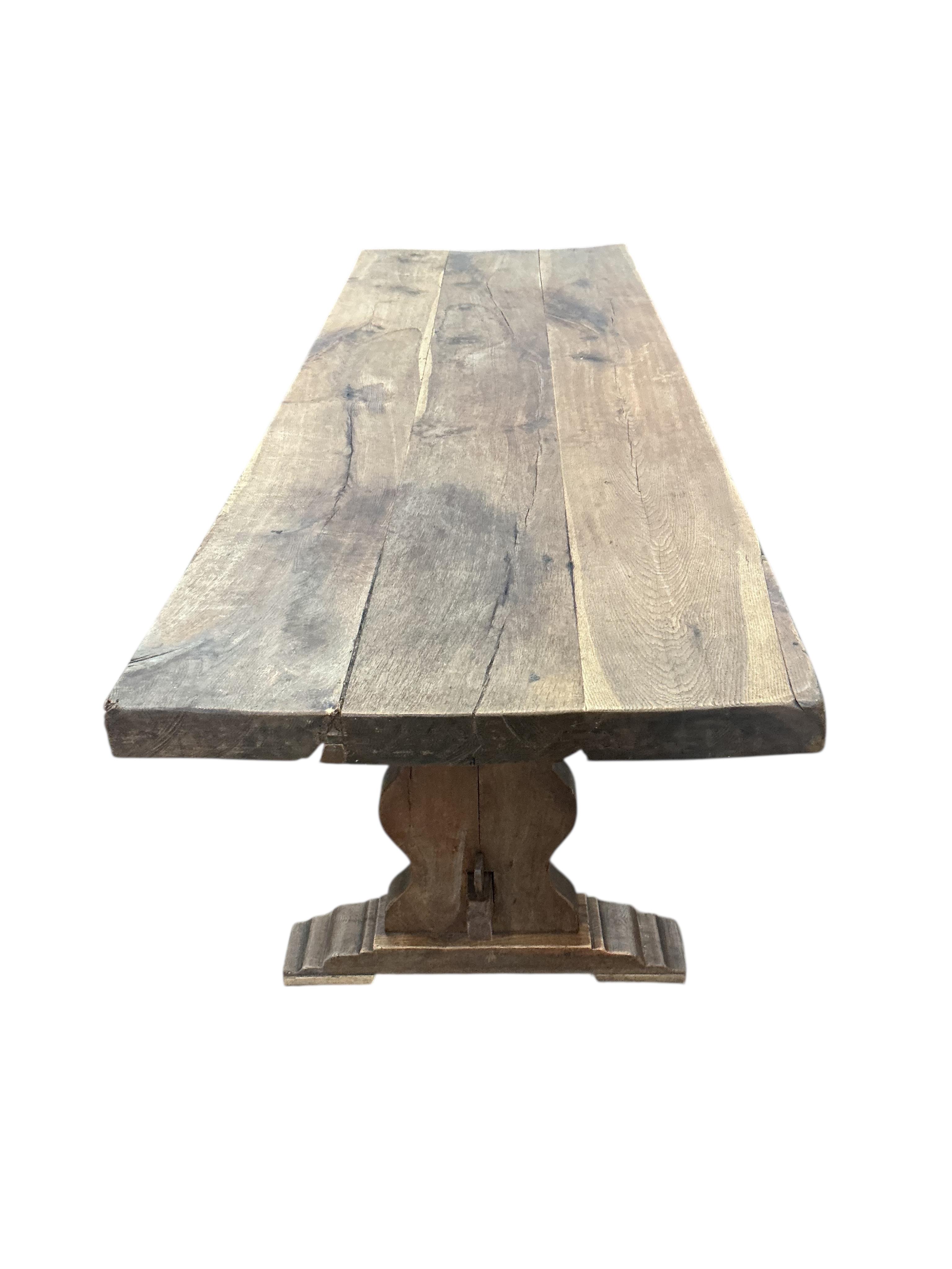 An 18th century style rectangular oak refectory dining table, width 214cm, depth 72cm, height 78cm